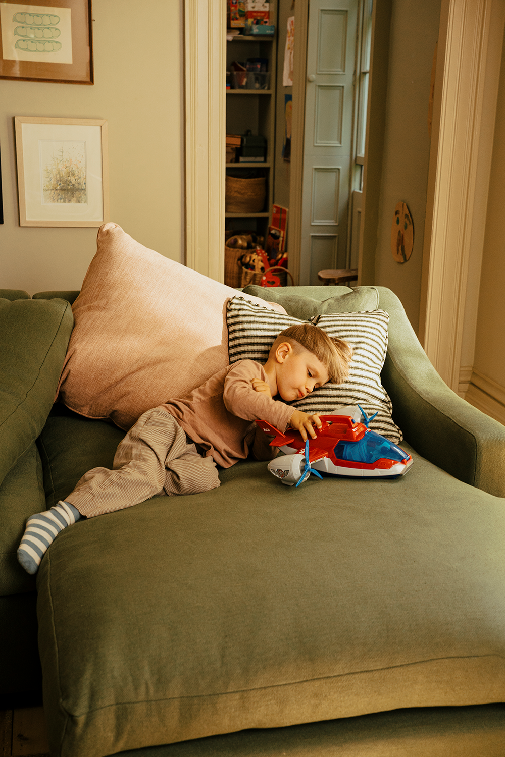 The family settling into life around the Hudson Sofa.
